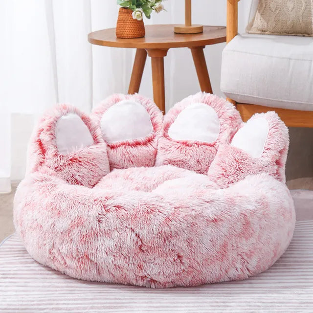 Hundebett in der Größe XXL (90cm Durchmesser) in der Farbe Pink mit weißen aufstehenden Pfoten.